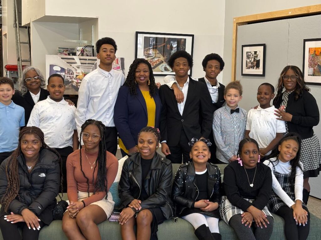 Group photo of students and staff at the etiquette class